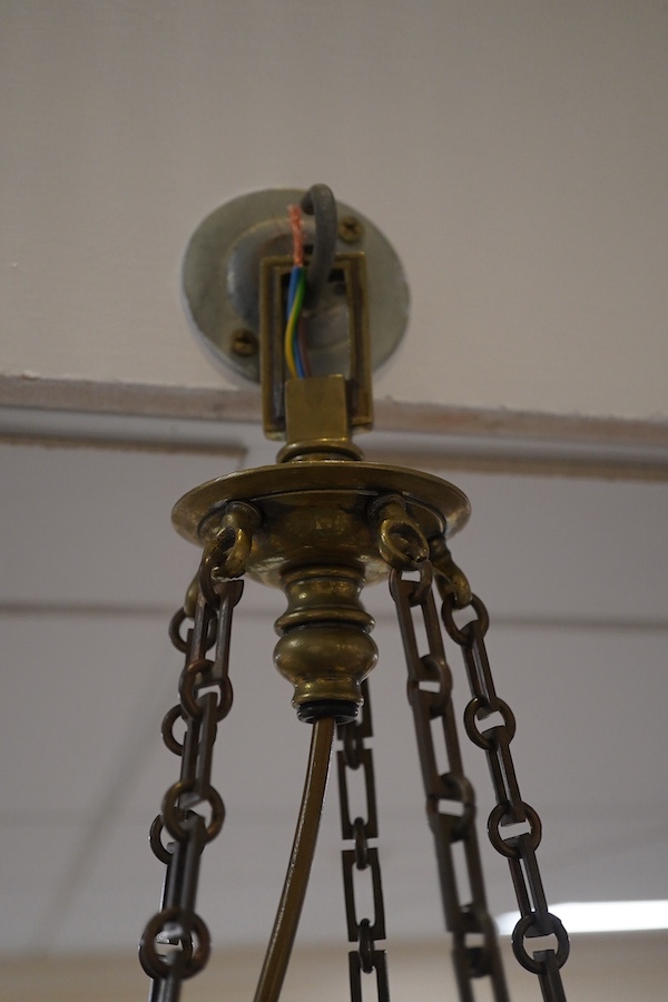 A French Empire style five light ceiling light in antique brass, early 20th century, wired, overall 68cm high, 48cm wide. Condition - fair to good, untested